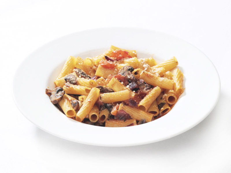 Rigatoni pasta in tomato sauce with aubergine, mozzarella and fresh basil